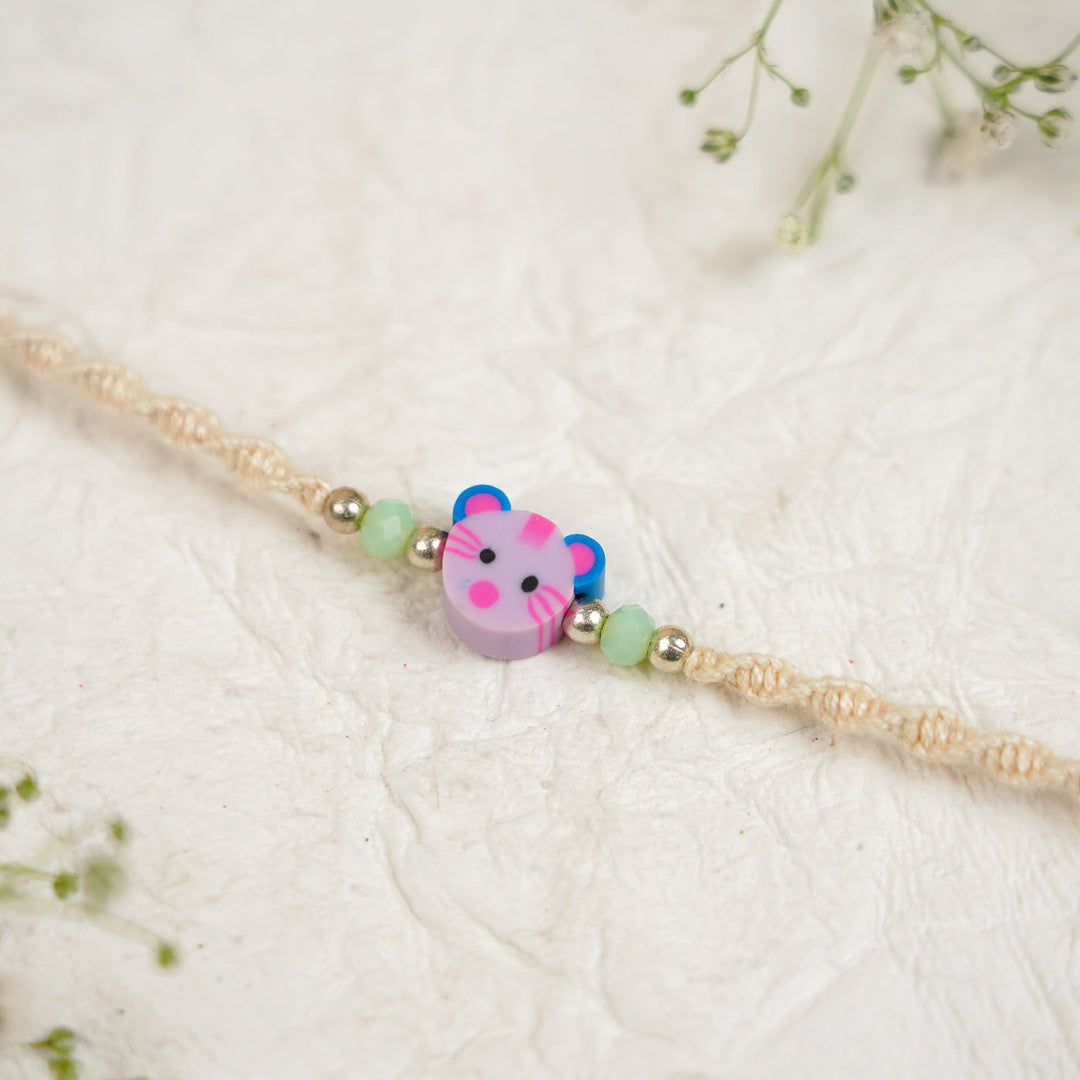 Handmade Cat Kids Rakhi With Roli Chawal 1 - Close-up of center bead detail