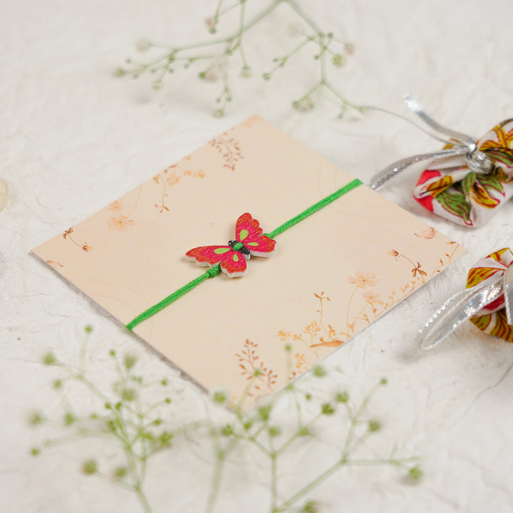 Handmade Butterfly Kids Rakhi With Roli Chawal - Angled View Showing Thickness