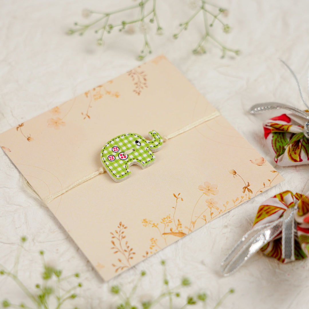 Handmade Elephant Kids Rakhi With Roli Chawal - Side Angle View
