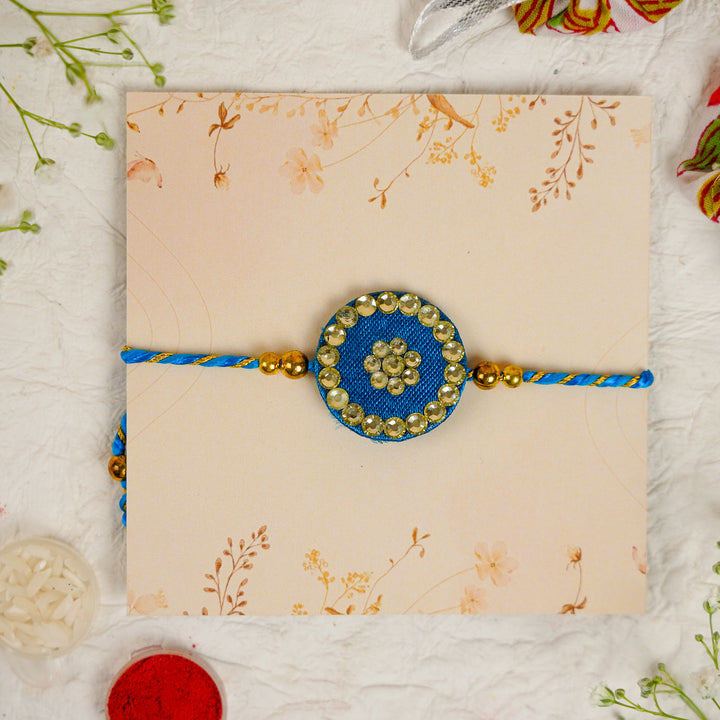 Handmade Silk Crystal Rakhi With Roli Chawal - Front View Blue Rakhi