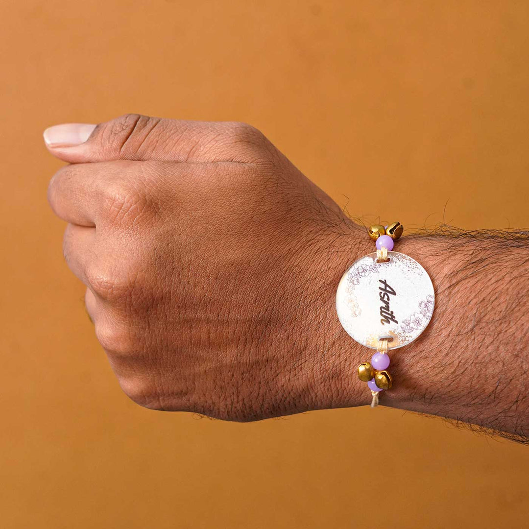 Personalized Hand Painted Name Acrylic Rakhi With Roli Chawal - Male Wrist Wearing Rakhi
