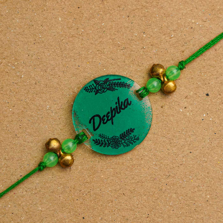 Personalized Hand Painted Name Acrylic Rakhi With Roli Chawal - Front View Close-up