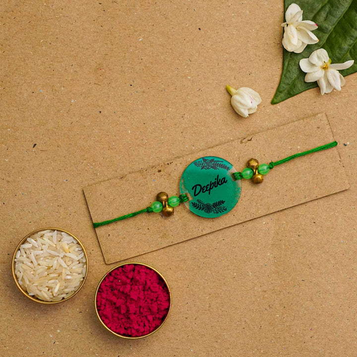 Personalized Hand Painted Name Acrylic Rakhi With Roli Chawal - Flat Lay with Rice and Kumkum (7)