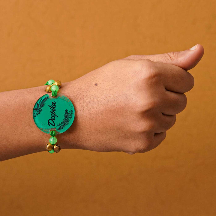 Personalized Hand Painted Name Acrylic Rakhi With Roli Chawal - Worn on Wrist View (8)
