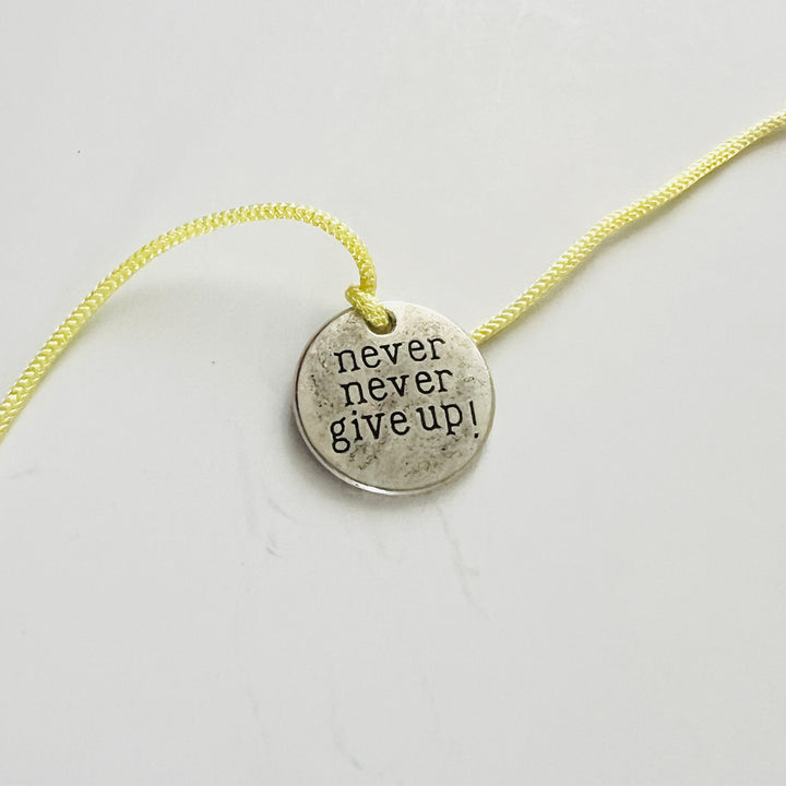 Engraved "Never Never Give Up" Quote Metal Charm Rakhi With Roli Chawal for Brother