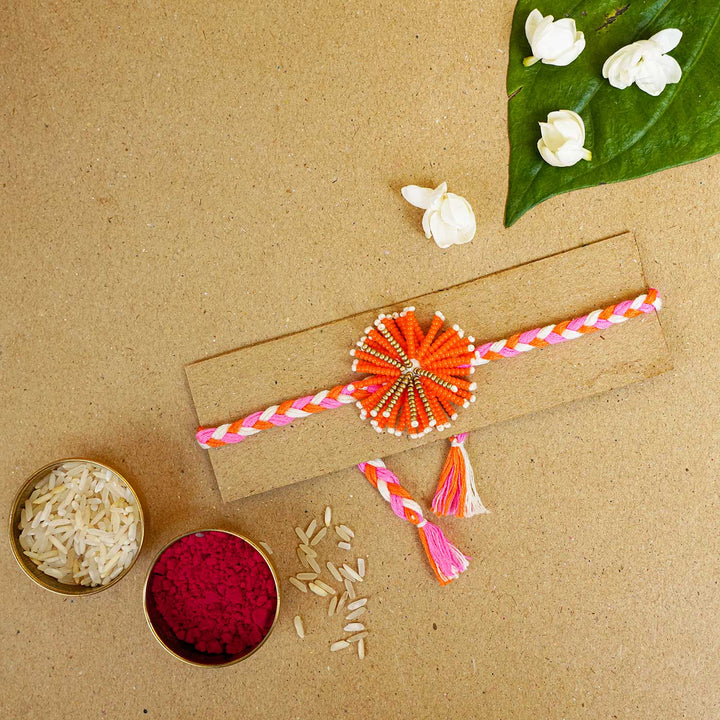 Reusable Beaded Orange Flower Rakhi With Roli Chawal - Bracelet with Festive Items