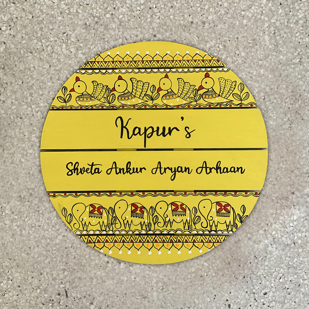 Round Hand Painted Madhubani Art Name Plate 3 - Top-down View on Surface