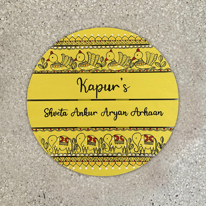Round Hand Painted Madhubani Art Name Plate 3 - Top-down View on Surface