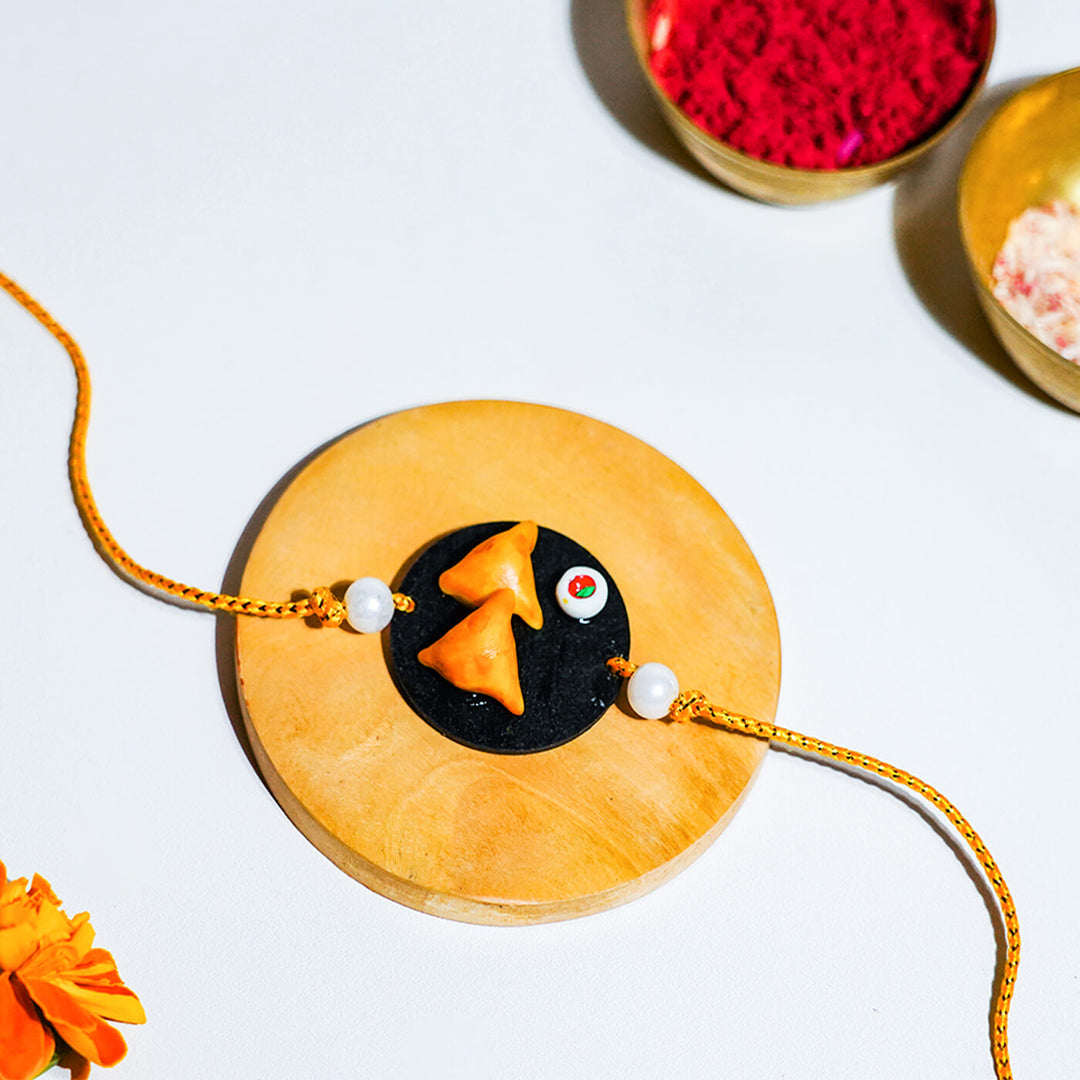 Handmade Food Themed Clay Rakhi 1 - Close-up Front View