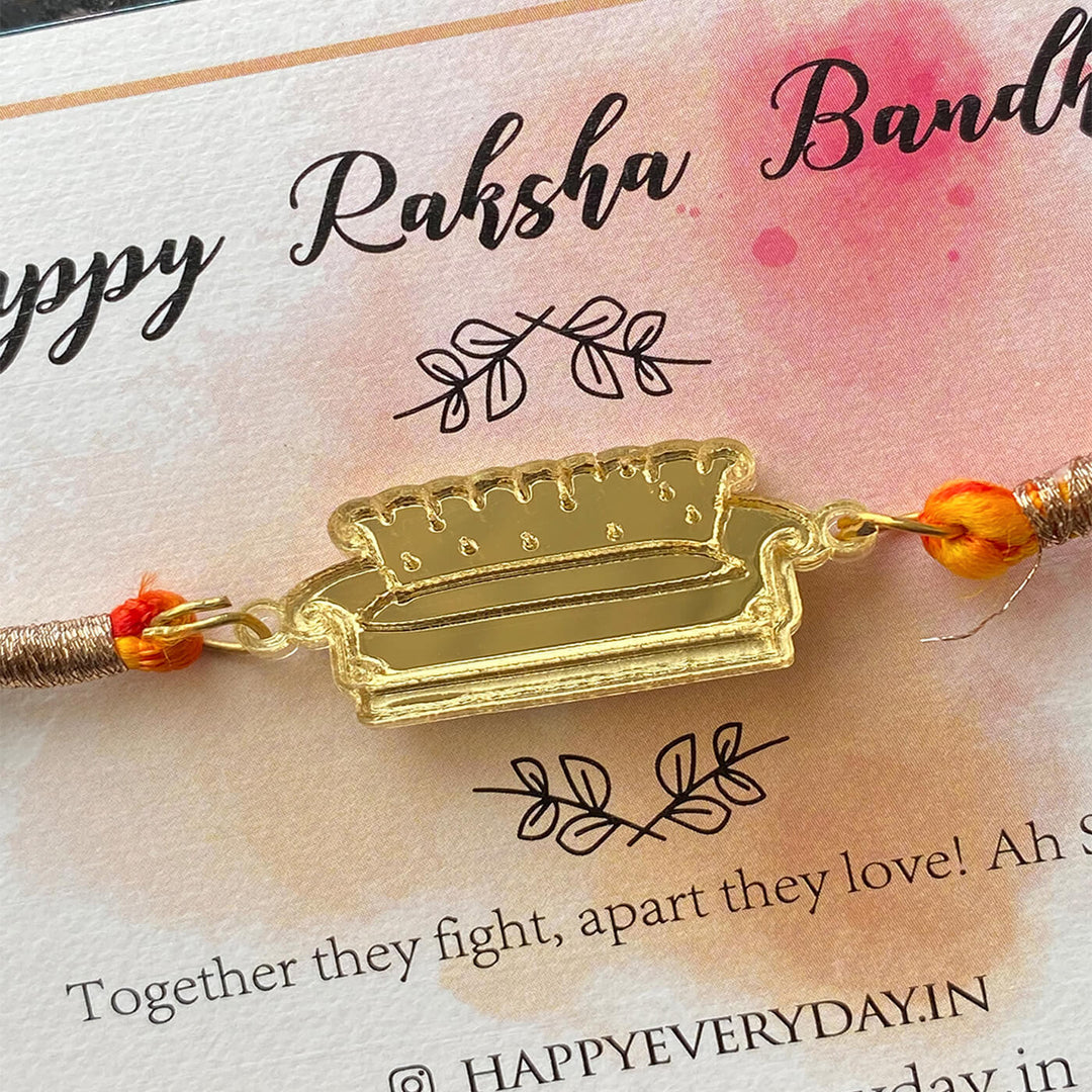 Handcrafted Golden Acrylic Rakhi With Roli Chawal 5 - On packaging card close-up detail