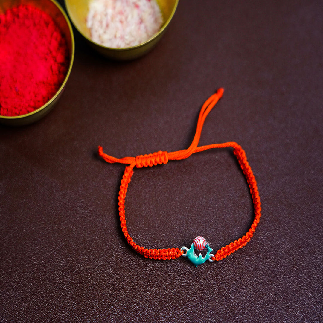 Handcrafted Silver Motif Adjustable Rakhi For Kids With Rice & Roli