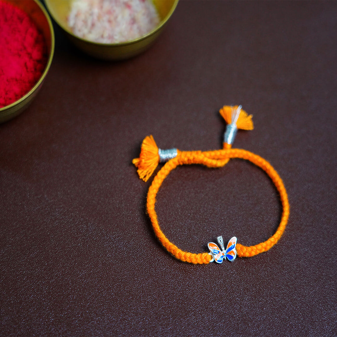 Handcrafted Silver Motif Adjustable Rakhi For Kids With Rice & Roli