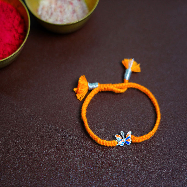 Handcrafted Silver Motif Adjustable Rakhi For Kids With Rice & Roli