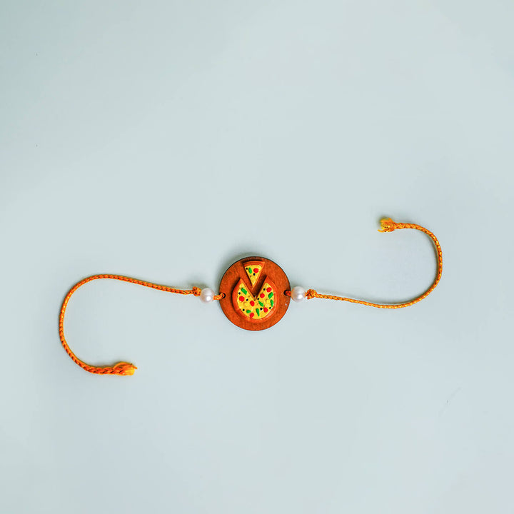 Handmade Food Themed Clay Rakhi 6 - Flat Lay with Pizza Charm