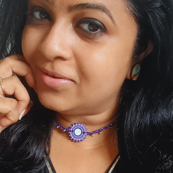 Handmade Puprle Ghungroo Shell And Beads Wooden Bhaiya Bhabhi Rakhi With Roli Chawal - Model Wearing Necklace Front View