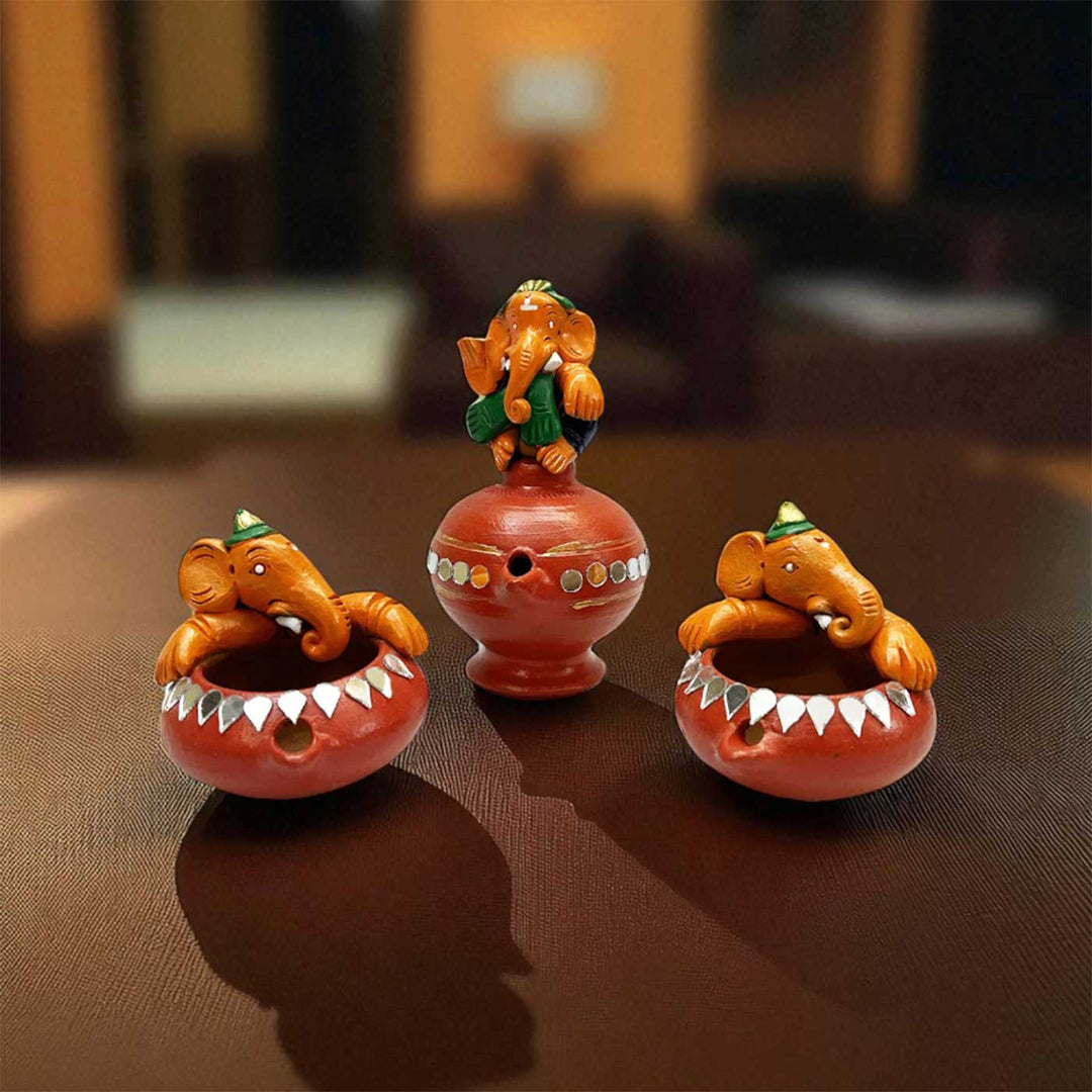 Handmade Painted Ganesh Design Terracotta Oil Lamp / Diya | Includes 1 Magic Diya And 2 Diyas