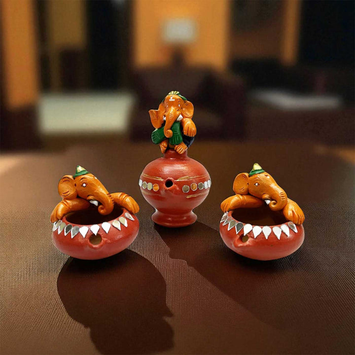Handmade Painted Ganesh Design Terracotta Oil Lamp / Diya | Includes 1 Magic Diya And 2 Diyas