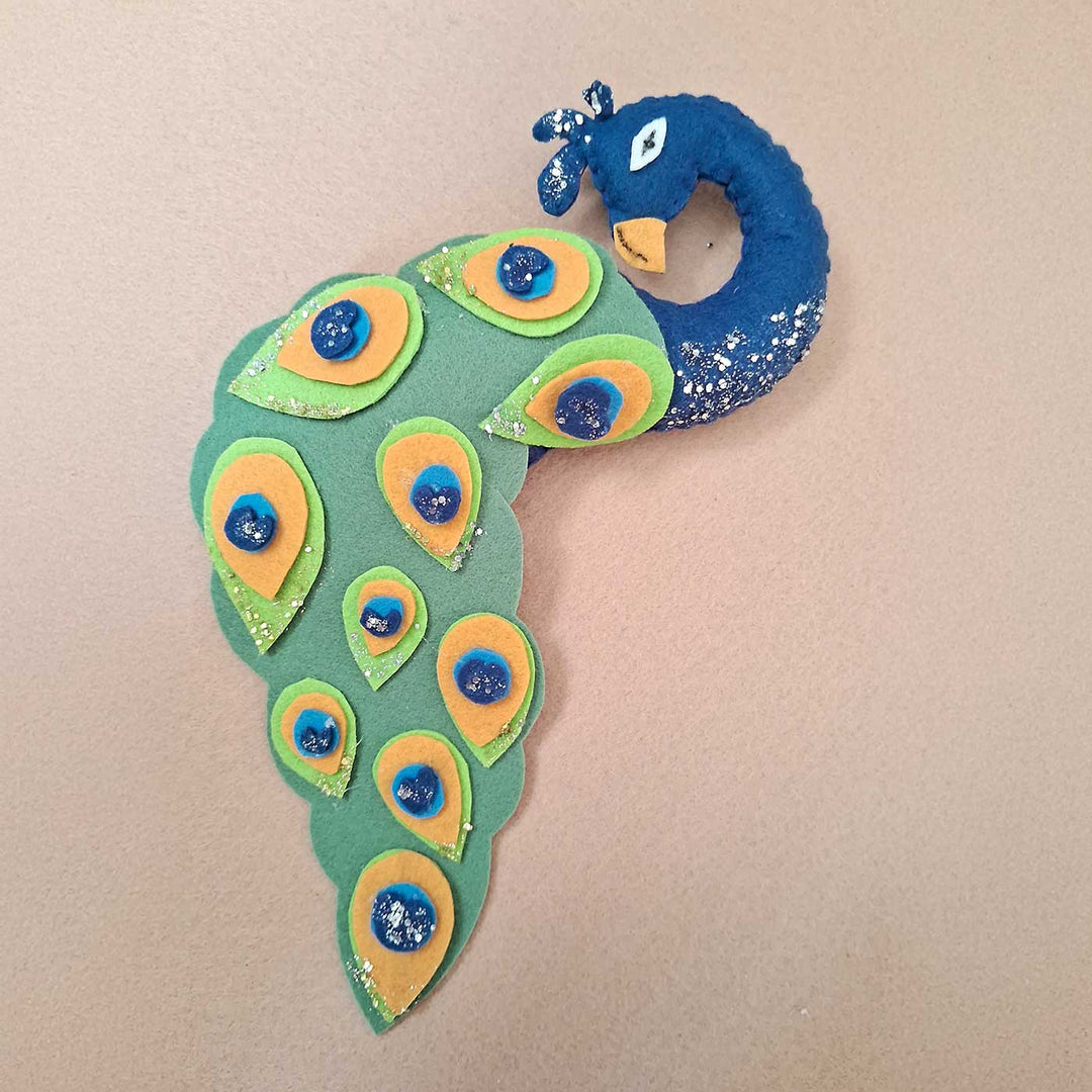 Personalized Peacock And Deer Themed Felt Bunting For Kids - Top Angle View on Flat Surface