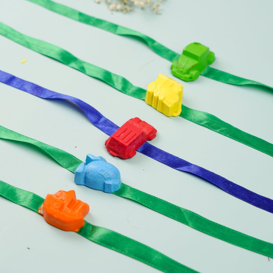 Reusable Non Toxic Vehicle Theme Wax Kids Rakhi Set Of 5 - Close-up on colorful vehicle toys