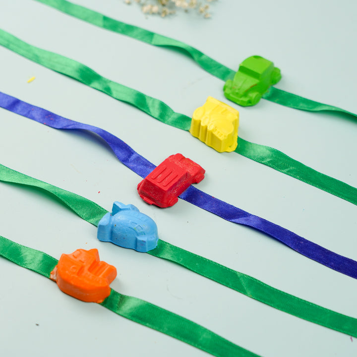 Reusable Non Toxic Vehicle Theme Wax Kids Rakhi Set Of 5 - Close-up on colorful vehicle toys