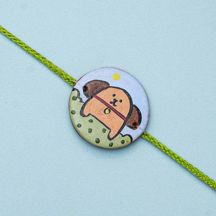 Personalized Animal Theme Terracotta Rakhi With Roli Chawal For Kids 1 - Close-up of Circular Charm