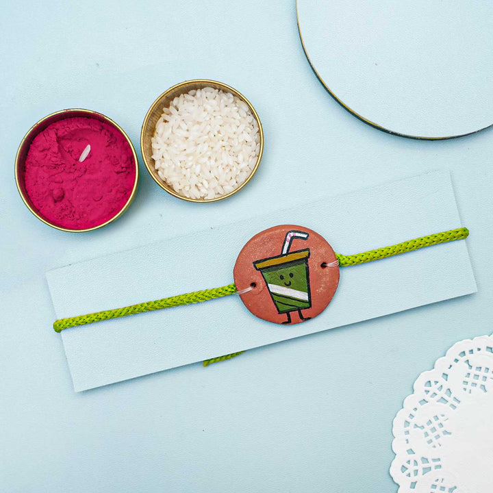 Hand-painted Juice Terracotta Rakhi With Roli Chawal