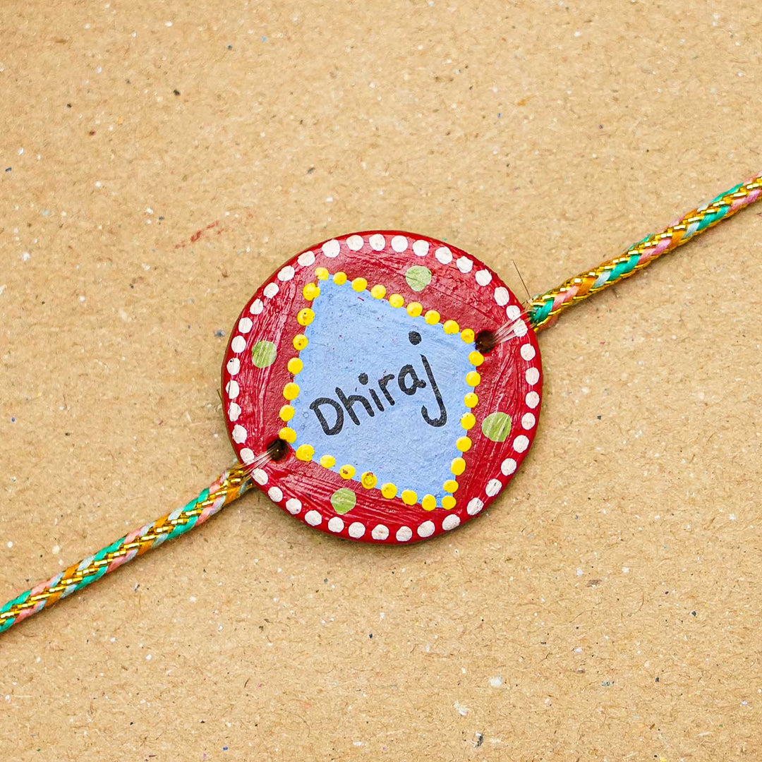 Personalized Terracotta Red & Blue Rakhi With Roli Chawal