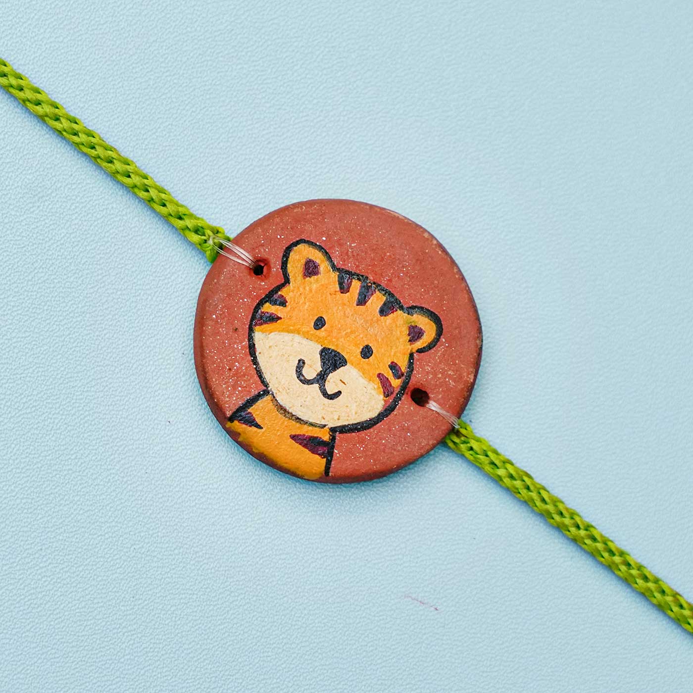 Buy Hand-painted Tiger Terracotta Rakhi With Roli Chawal for Kids ...