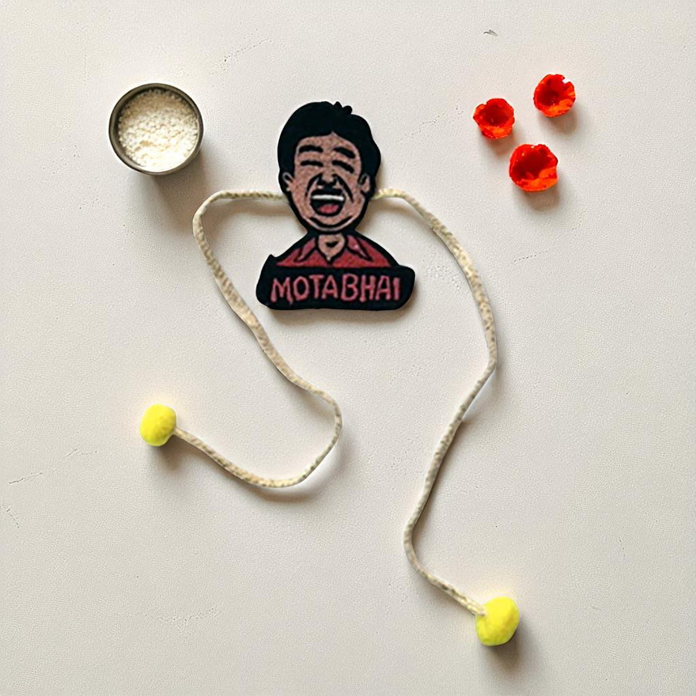 Handmade Reusable Mota Bhai Pom Pom Felt Rakhi For Brother - Flat Lay of Rakhi and Accessories