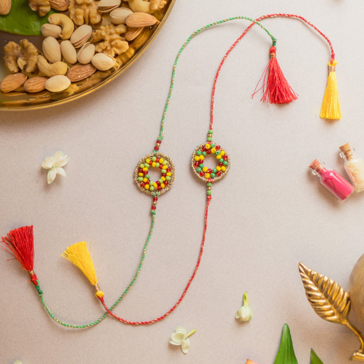 Intricate Beaded Crochet Rainbow Threads Rakhi With Roli Chawal | Set of 2