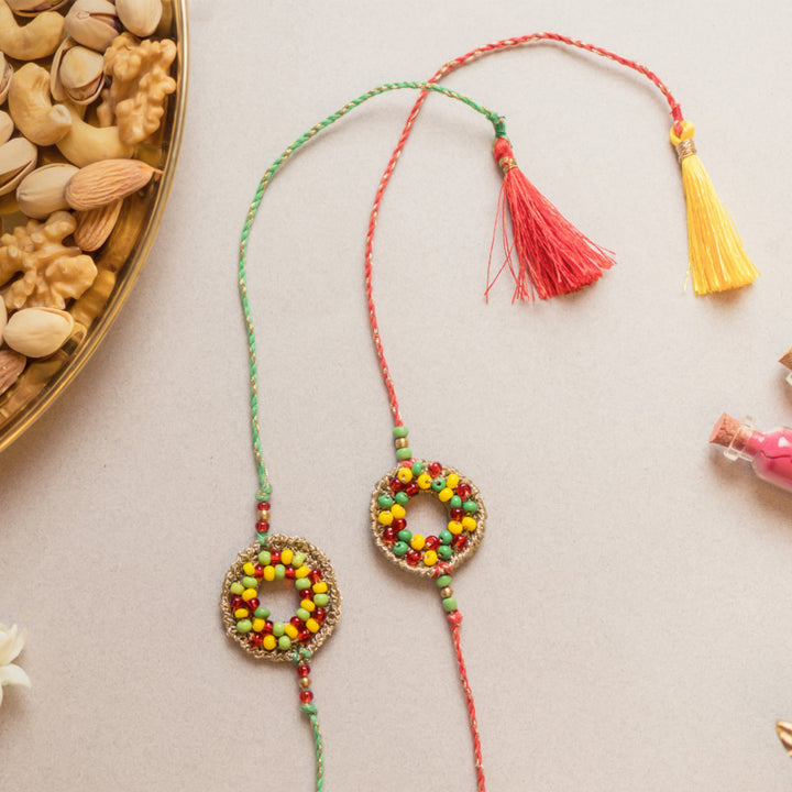 Intricate Beaded Crochet Rainbow Threads Rakhi With Roli Chawal | Set of 2