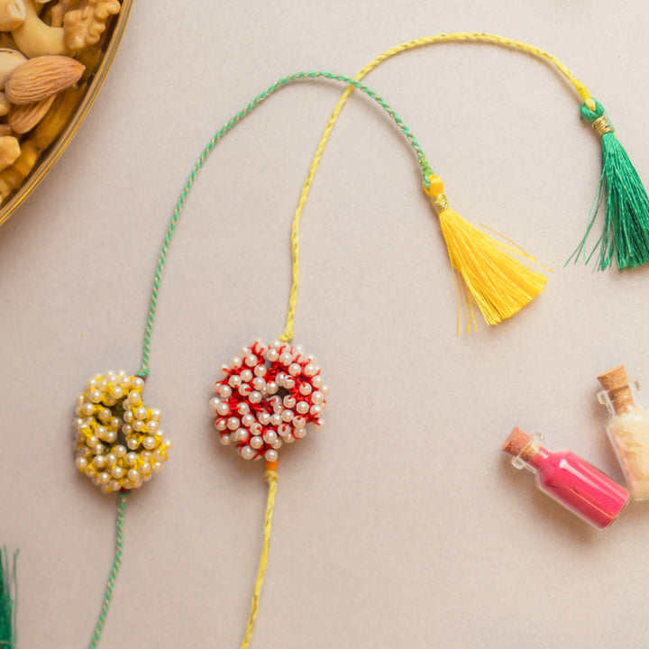 Intricate Crochet Beaded Coral Rakhi With Roli Chawal | Set of 2