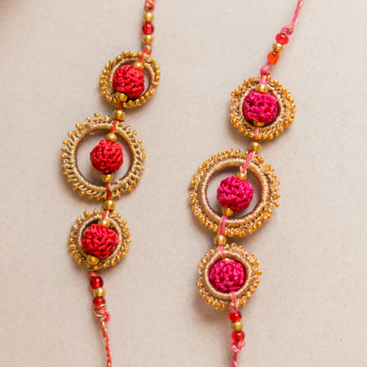Intricate Beaded Crochet Sacred Loop Rakhi With Roli Chawal | Set of 2
