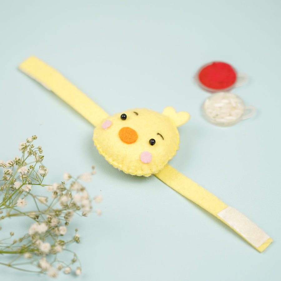 Handmade Duck Theme Felt Kids Rakhi With Roli Chawal - Top View Laid Flat