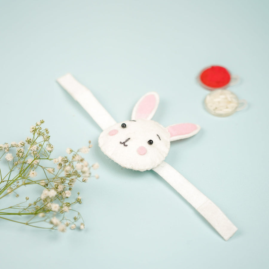 Handmade Bunny Theme Felt Kids Rakhi With Roli Chawal - Top View with Props