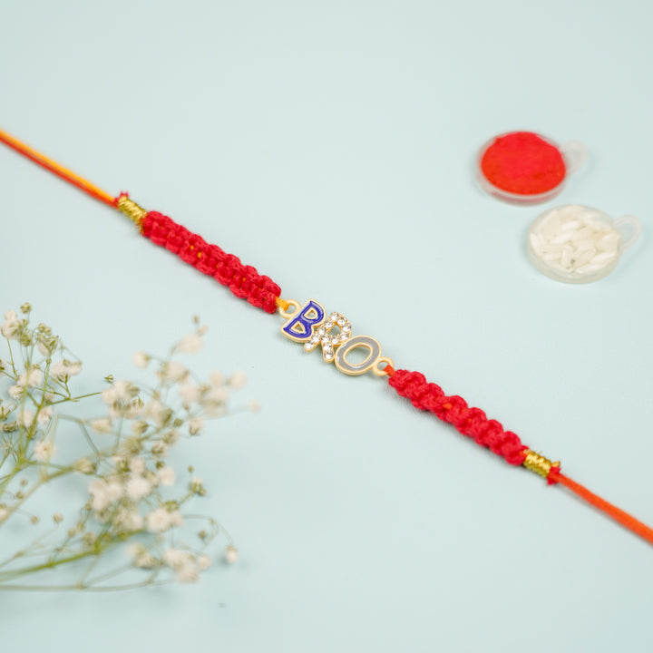 Handmade Macrame Bro Theme Evil Eye Metal Rakhi With Roli Chawal - Layflat View with Decorative Items