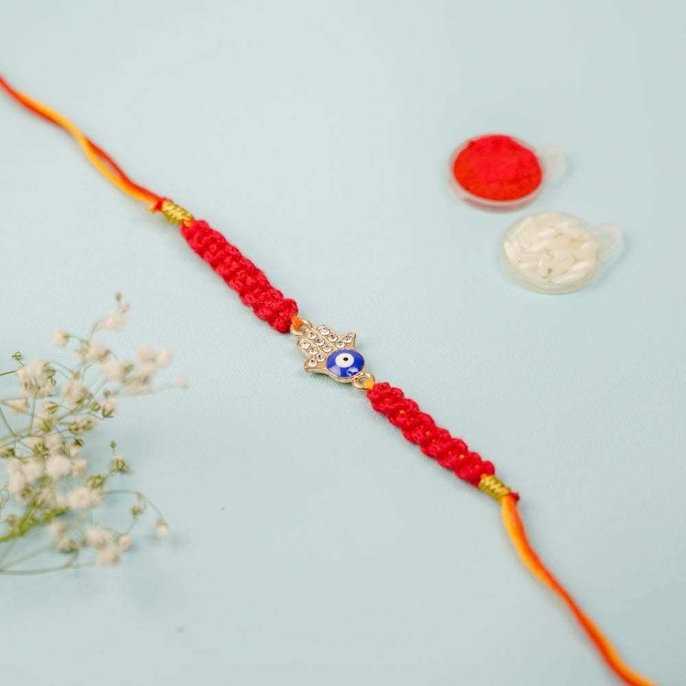 Handmade Macrame Hamsa Evil Eye Metal Rakhi With Roli Chawal - Bracelet with Additional Items Displayed