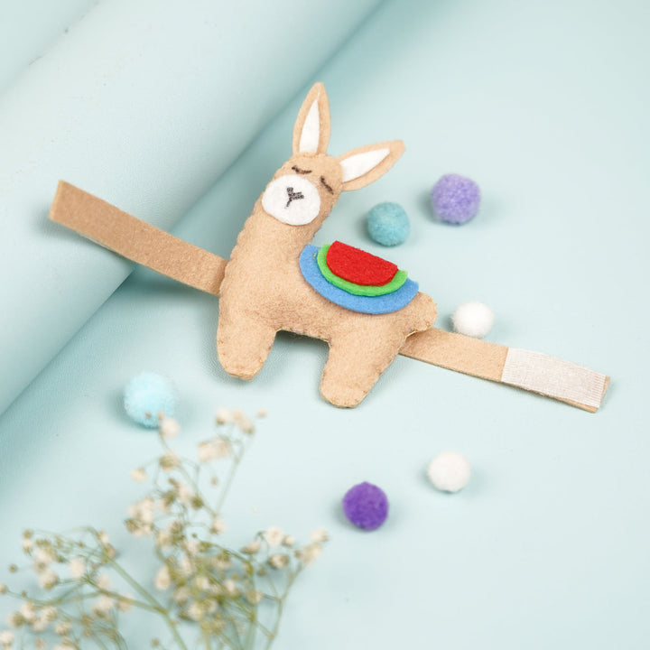 Handmade Lama Theme Felt Kids Rakhi With Roli Chawal - Top View with Decorative Elements