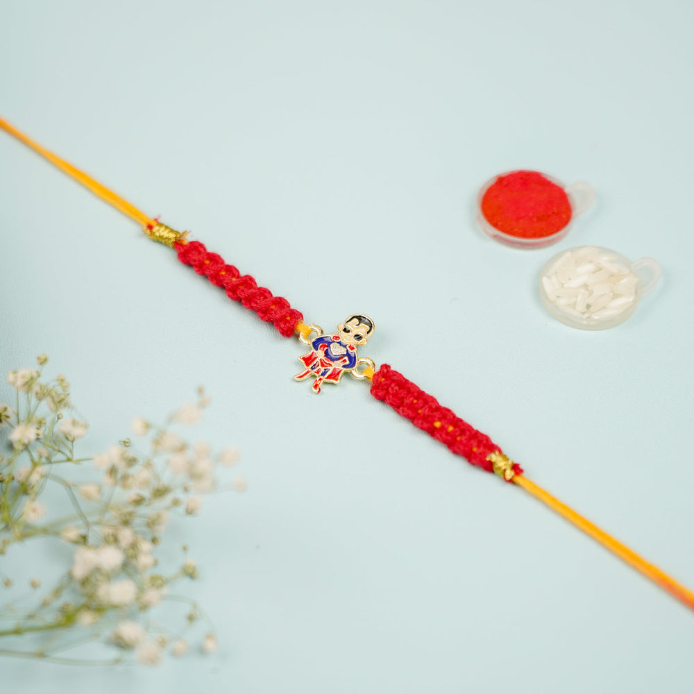 Handmade Macrame Superman Theme Metal Rakhi With Roli Chawal - Full Length View on Surface