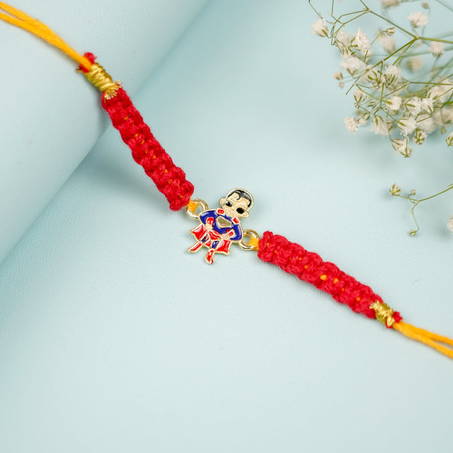 Handmade Macrame Superman Theme Metal Rakhi With Roli Chawal - Close-up Front View