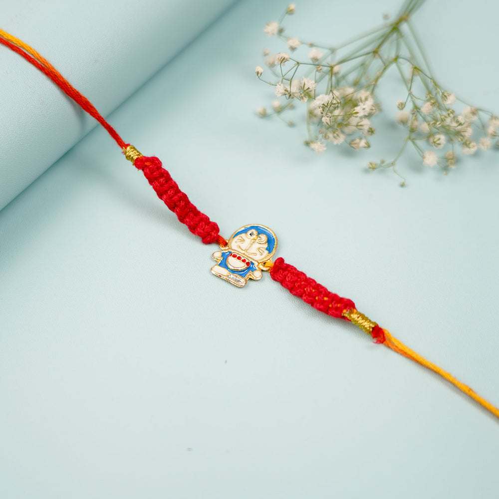 Handmade Macrame Doremon Theme Metal Rakhi With Roli Chawal - Close-Up with Floral Accent