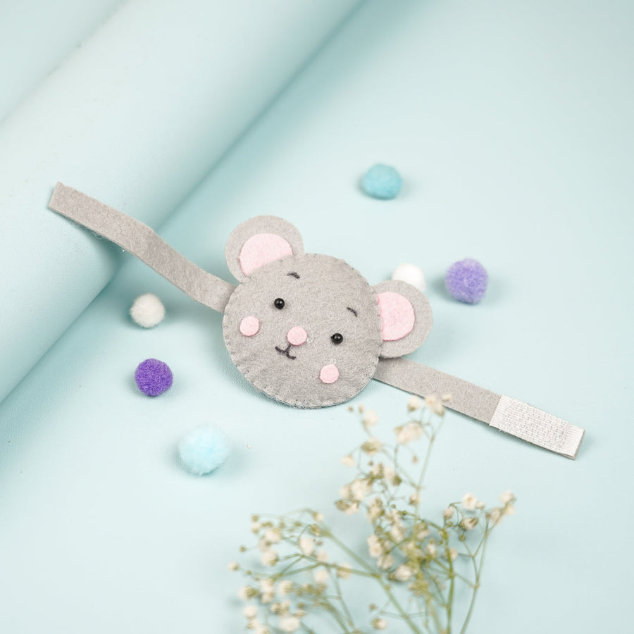 Handmade Koala Theme Felt Kids Rakhi With Roli Chawal - Flat Lay with Decorative Pom Poms