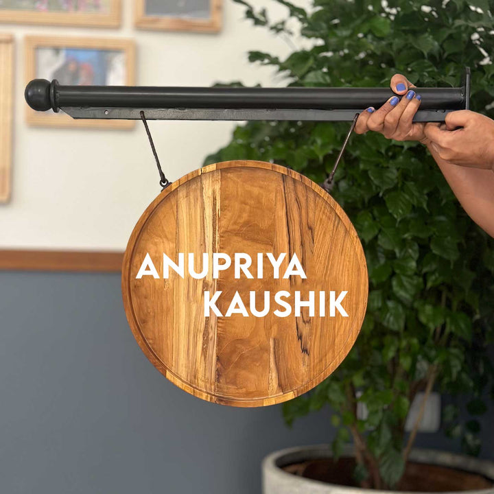 Premium Double Sided Teak Wood Hanging Name Plate With Iron Bracket - Hanging from Metal Bracket Side View