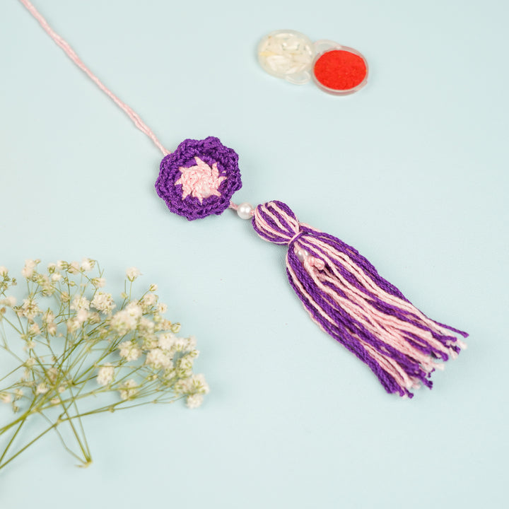 Handmade Crochet Purple Floral And Beads Rakhi With Roli Chawal For Bhaiya Bhabhi And Kids - Close-up of Tassel Detail