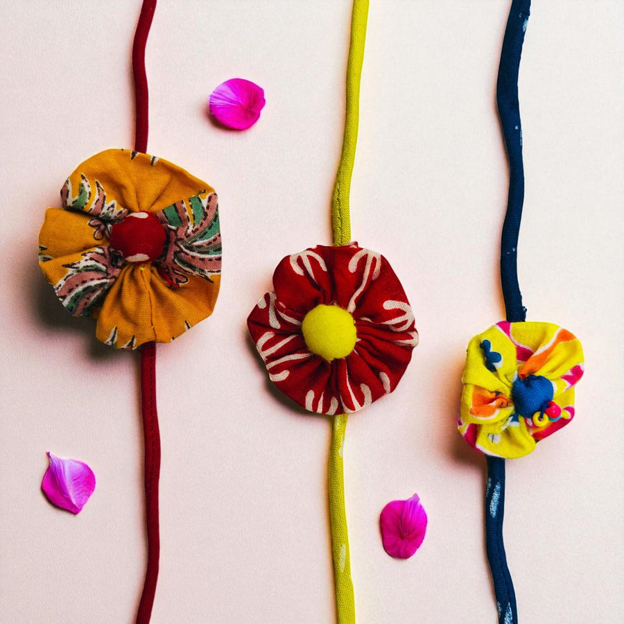 Handmade Flower Upcycled Fabric Rakhi With Roli Chawal For Brother - Multiple Floral Strap Front View