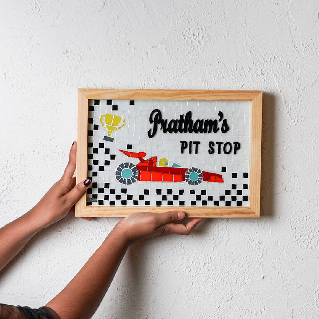 Handcrafted Mosaic Personalized Name Plate With Wooden Frame 5 - Held in Hands Against Wall