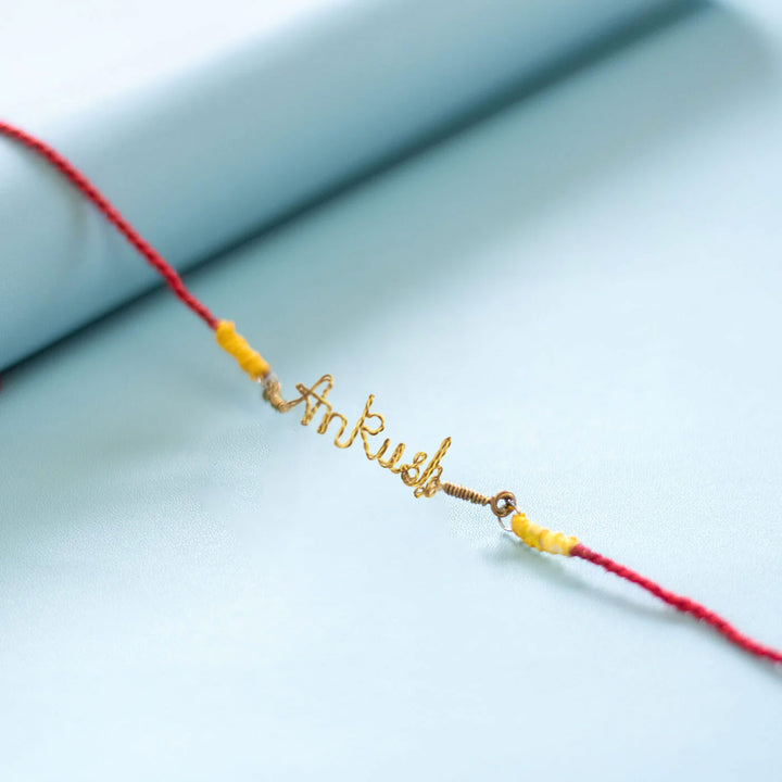 Personalized Brass Lettering Rakhi With Roli Chawal
