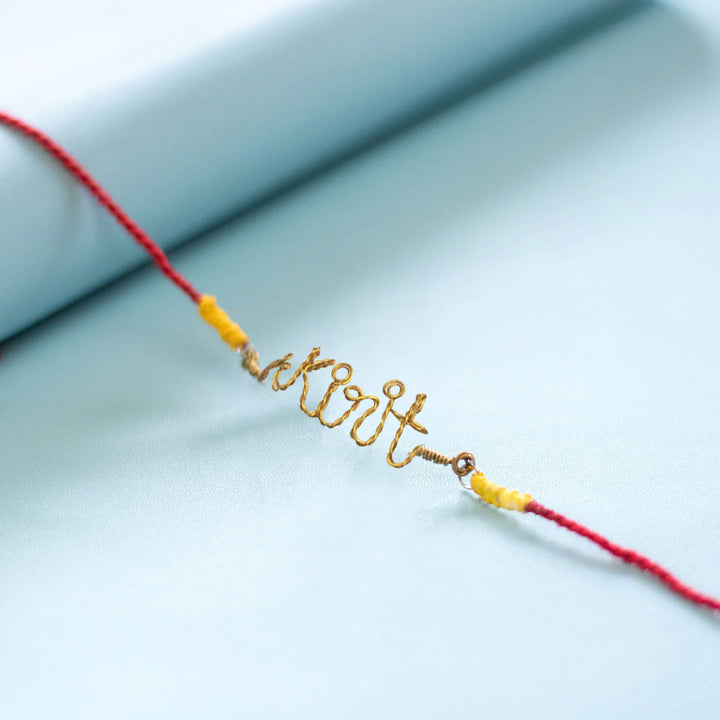 Personalized Brass Lettering Rakhi With Roli Chawal