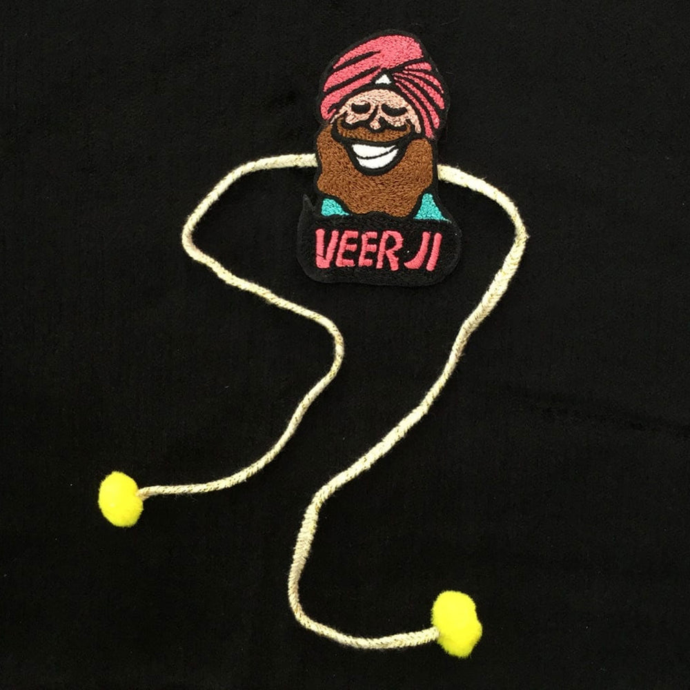Handmade Punjabi Veer Ji Felt Rakhi For Brother - Flat Laying on Black Fabric