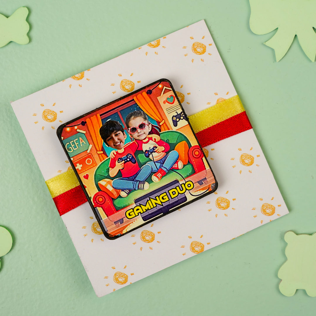 Photo Personalized Handmade Reusable Caricature Gaming Duo Mdf Wood Rakhi With Roli Chawal For Siblings - Badge attached to decorative card